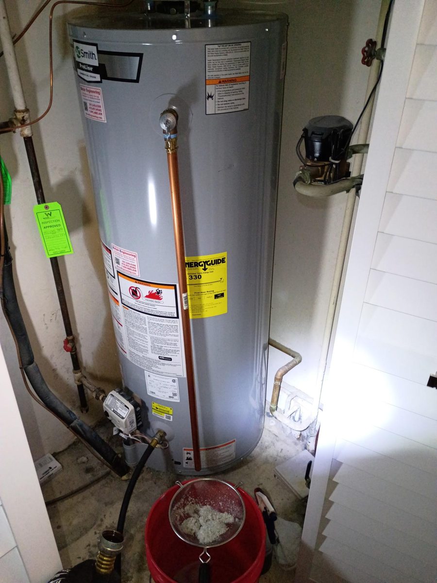 System serviced: Two years of sediment pulled out of a 50-gallon gas tank during a flush and service visit. Sediment like this is what shortens tank life and causes rumbling and slow recovery.