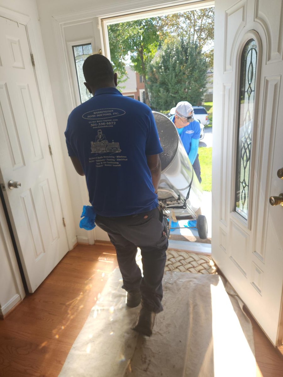 Protected delivery: New tank rolled in on floor protection and drop cloths from the front door to the utility closet. Old unit hauled away the same visit.