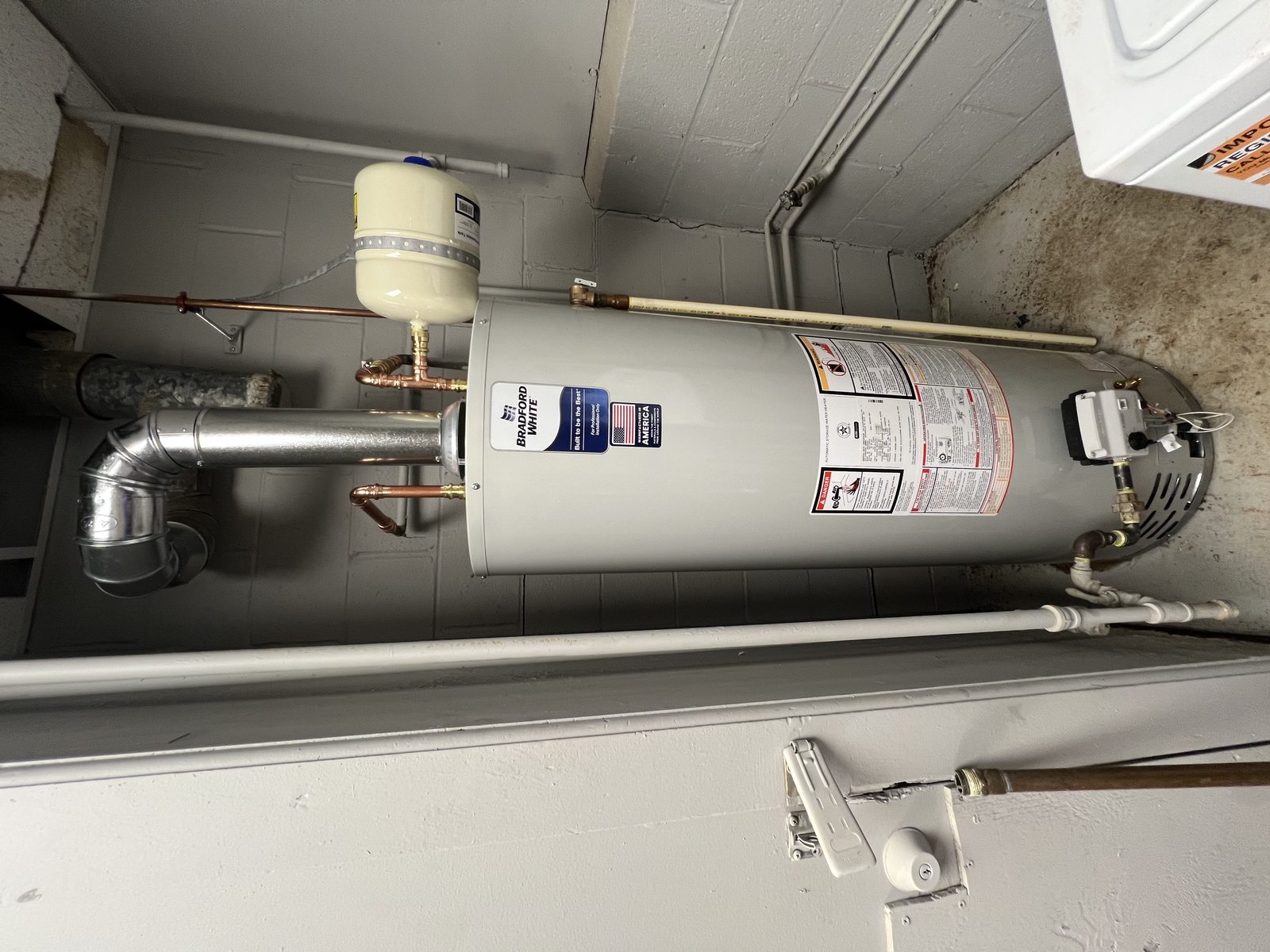 Water heater and connected piping at a Brentwood, Maryland service visit