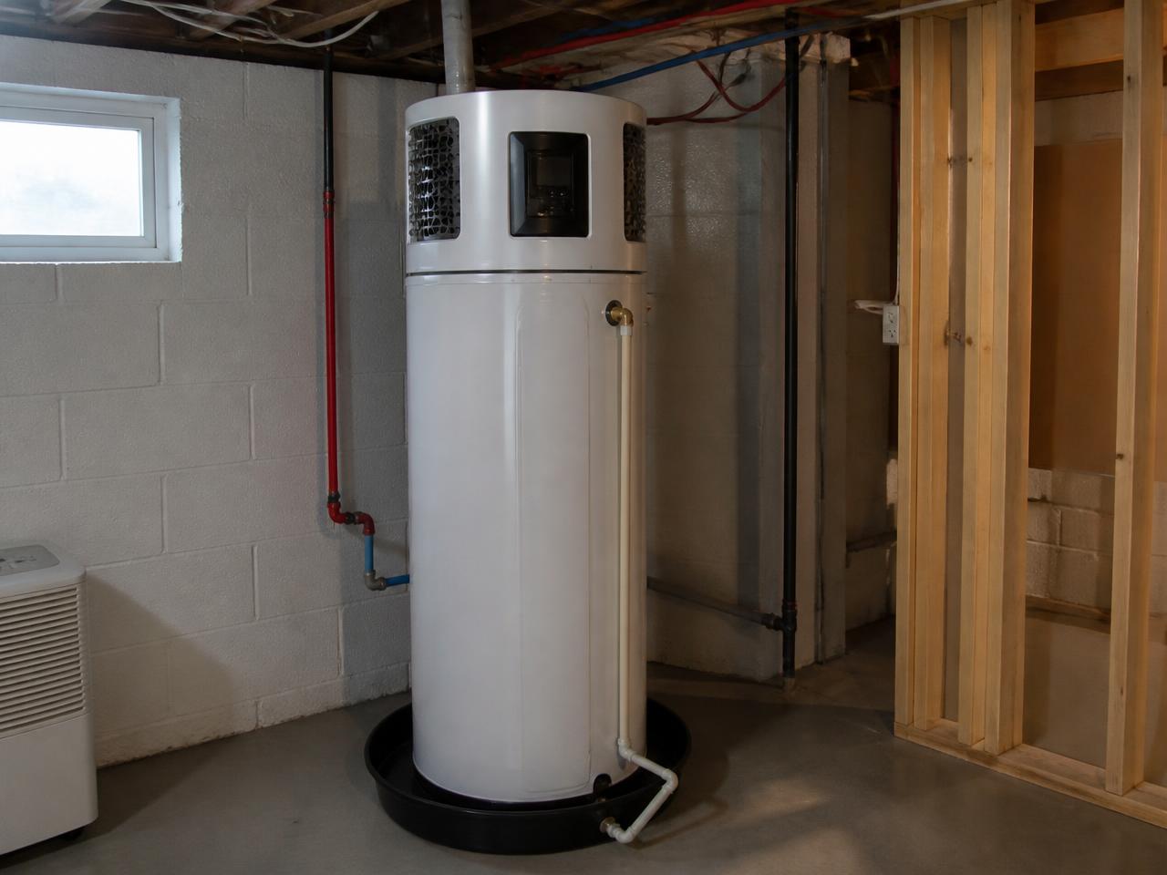 Hybrid heat pump water heater in a basement