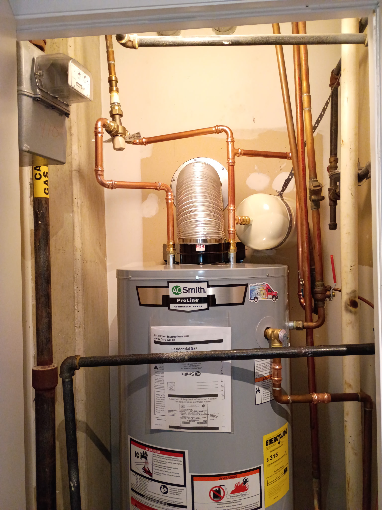 Direct-vent piping and service connections above an A. O. Smith water heater in Washington DC