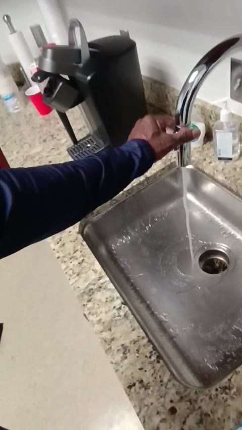 Kitchen faucet and sink during a faucet replacement in Rockville, Maryland