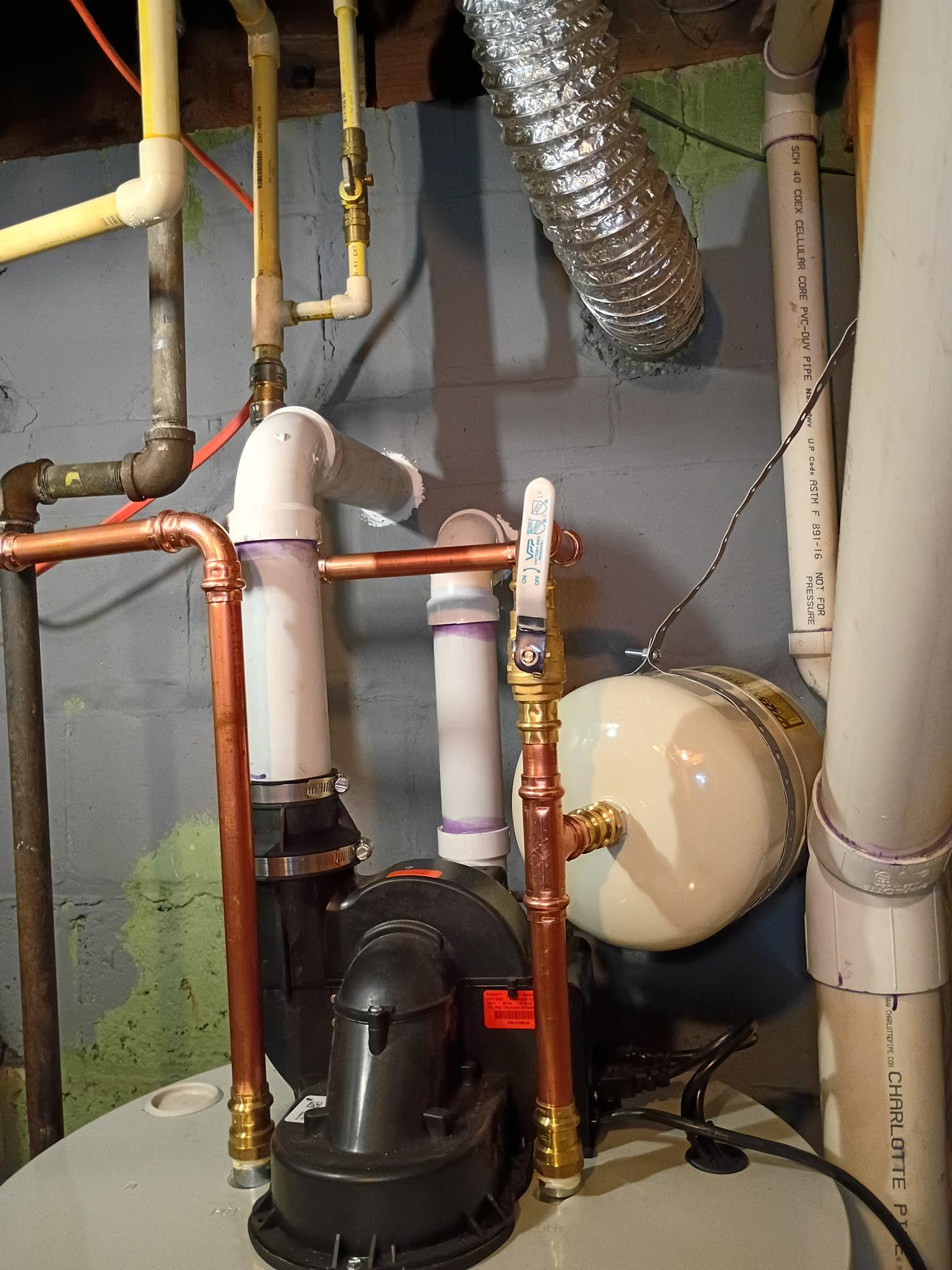 Power direct-vent piping and water connections above a new water heater