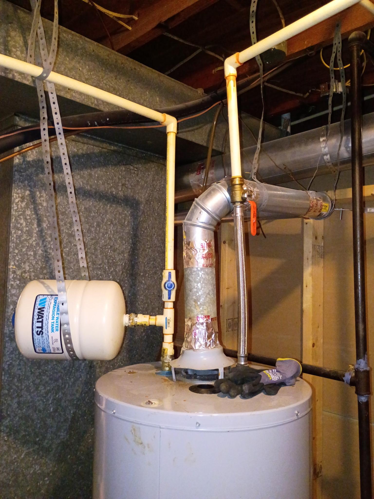 Existing water heater vent and expansion tank before the Temple Hills upgrade