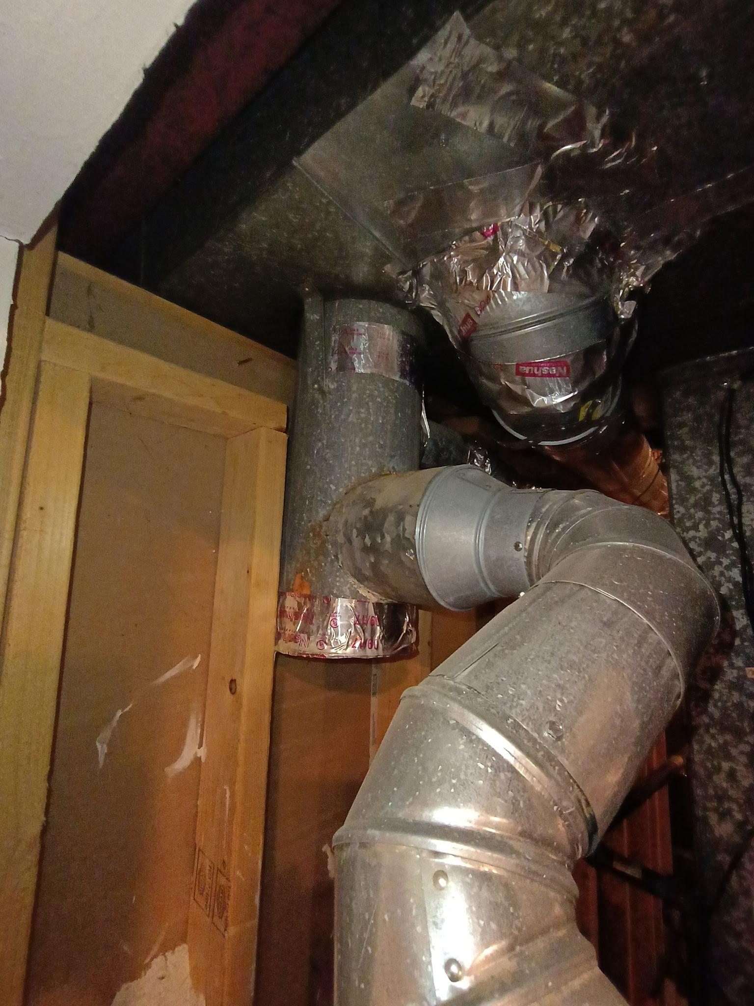 Existing flue connections documented before a Temple Hills water heater replacement