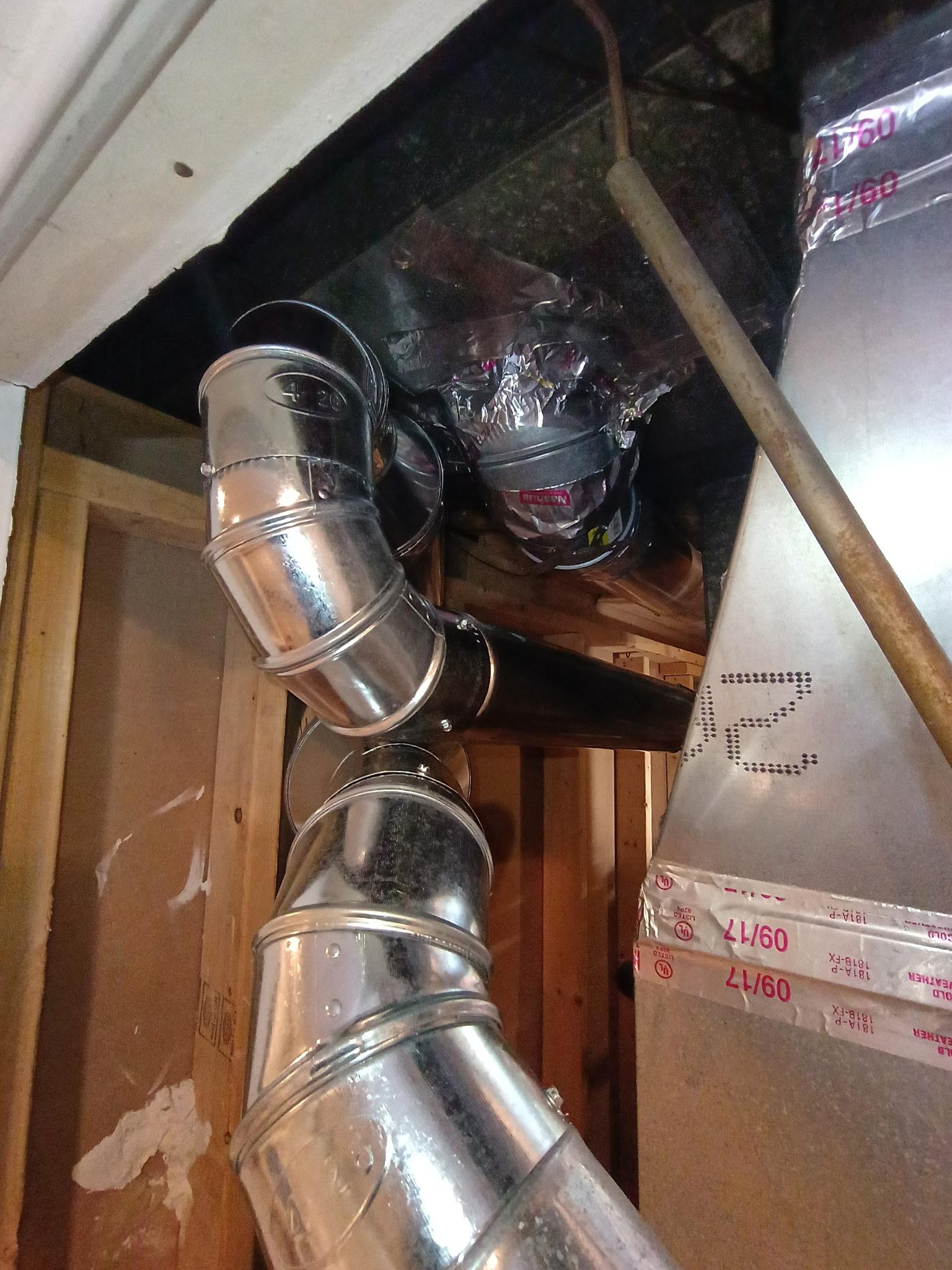 Close-up of the finished gas water heater flue upgrade in Temple Hills Maryland